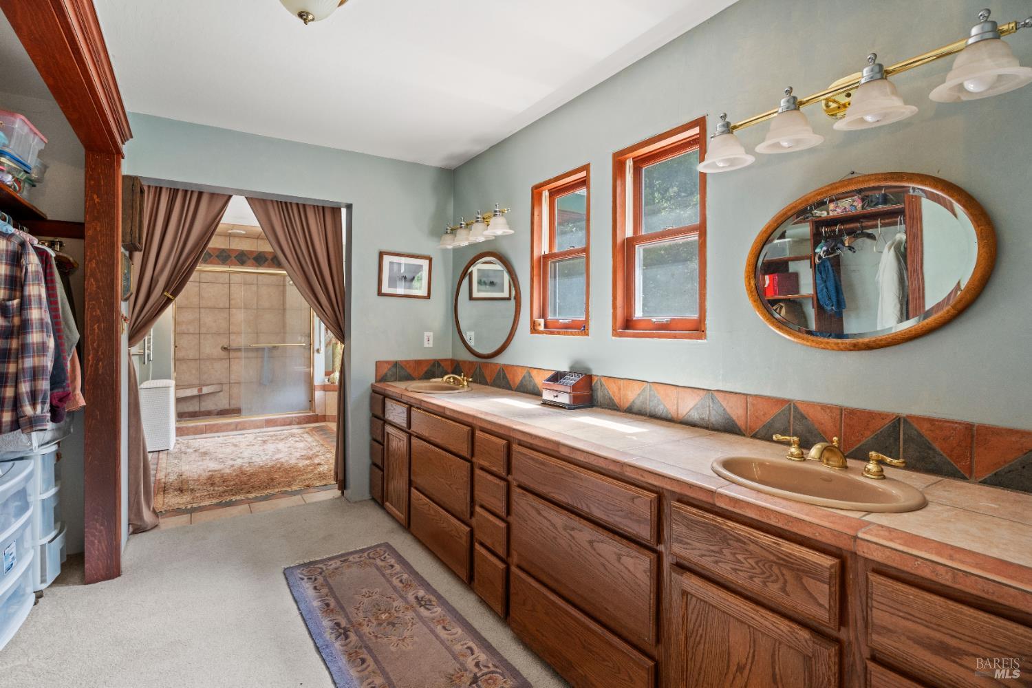 20475 Timber Road Willits, CA 95490 - Photo 19 of 38 a bathroom with a granite countertop double vanity sink and a mirror