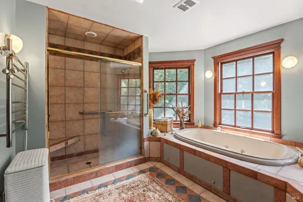 a bathroom with a sink and a shower