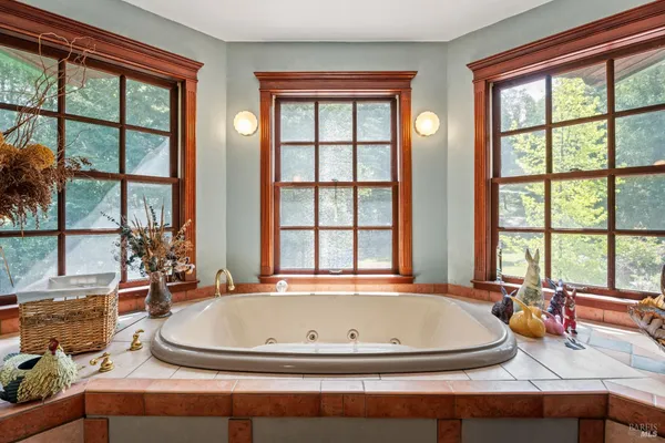 a view of living room with large windows and furniture
