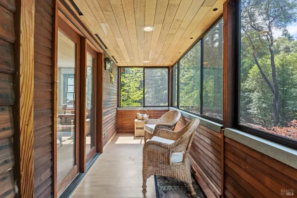 a view of balcony with furniture