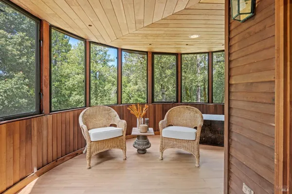 a view of a room with furniture and window