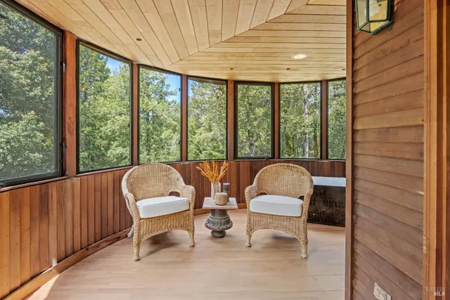 a view of a room with furniture and window