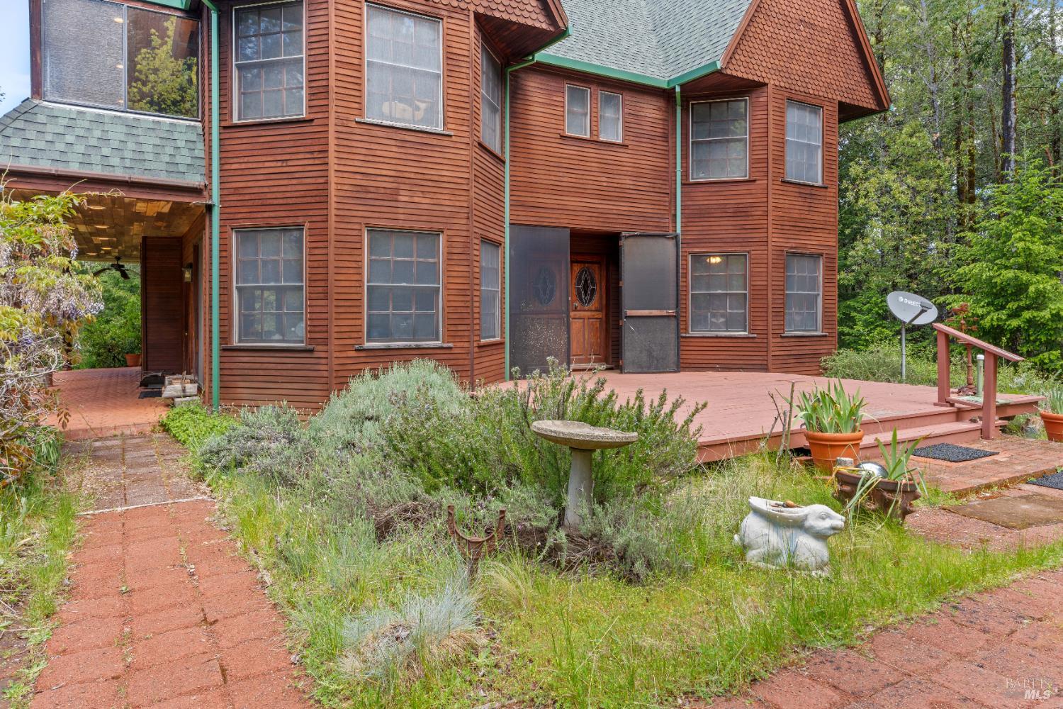 20475 Timber Road Willits, CA 95490 - Photo 28 of 38 a backyard of a house with outdoor seating