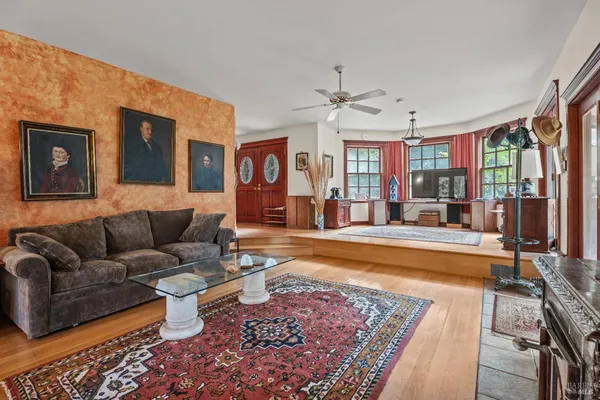 a living room with furniture rug and window