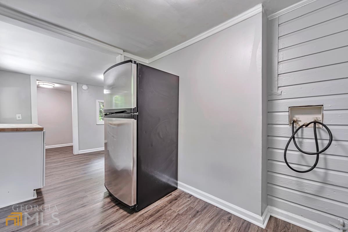 2846 Grand Avenue Southwest Atlanta, GA 30315 - Photo 12 of 19 a view of a room with wooden floor and white walls
