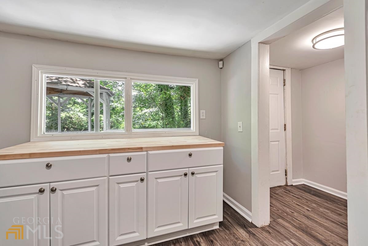 2846 Grand Avenue Southwest Atlanta, GA 30315 - Photo 15 of 19 a view of a kitchen with wooden floor and cabinet