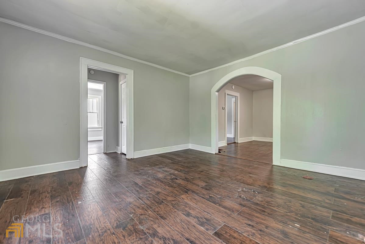 2846 Grand Avenue Southwest Atlanta, GA 30315 - Photo 6 of 19 a view of empty room with wooden floor and fan