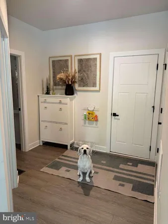 a view of an entryway with wooden floor