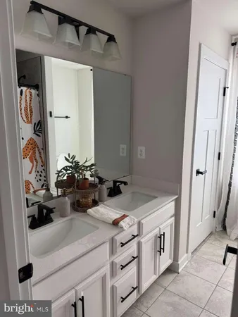 a bathroom with a toilet and a shower curtain