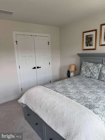 a room with gym equipment and a large window