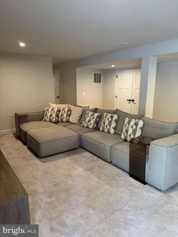 a bedroom with a bed and a mirror