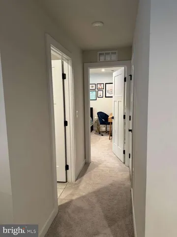 a view of a room with wooden floor and closet