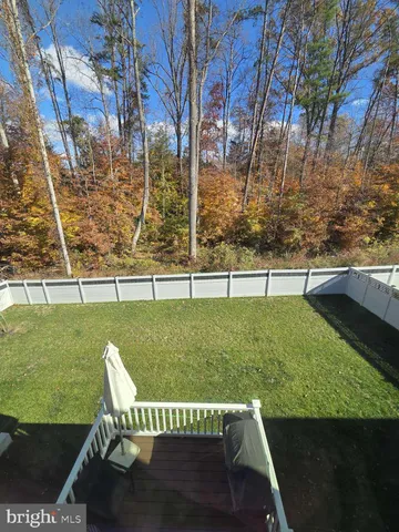a view of a house with a back yard