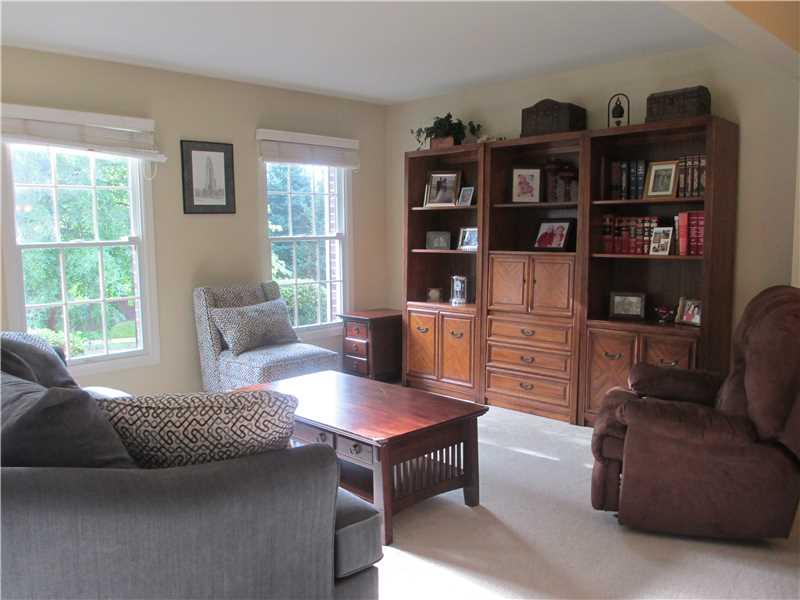 5 Castle View Drive McKees Rocks, PA 15136 - Photo 11 of 25 a living room with furniture a rug and a book shelf