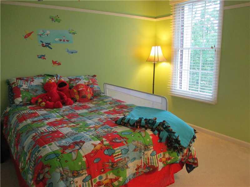 5 Castle View Drive McKees Rocks, PA 15136 - Photo 20 of 25 a bed sitting in a bedroom next to a window