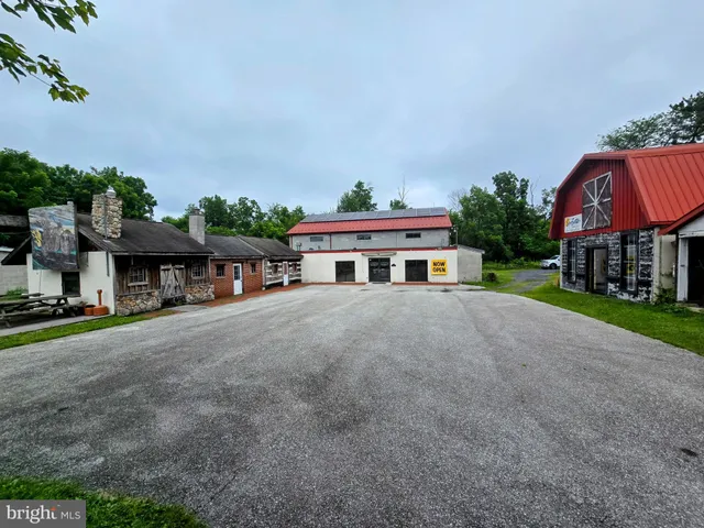a front view of house with yard and trees