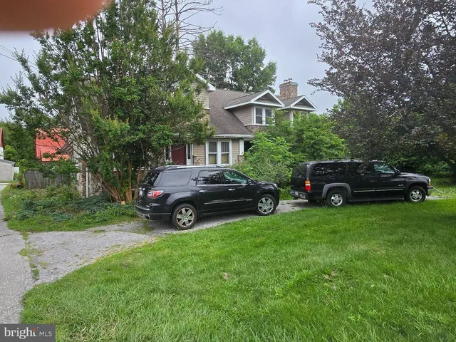 a view of a car parked in front of a house