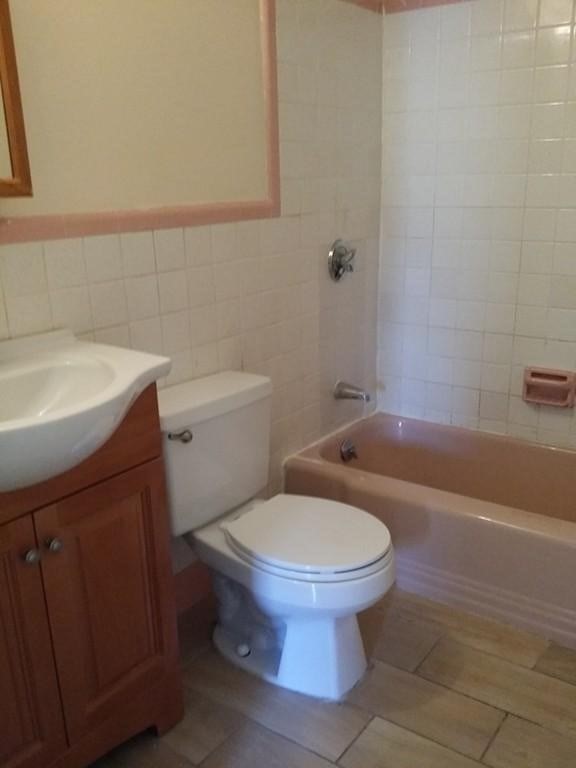 12 Commonwealth Court, Unit 15 Boston, MA 02135 - Photo 11 of 12 a bathroom with a sink toilet and a bathtub