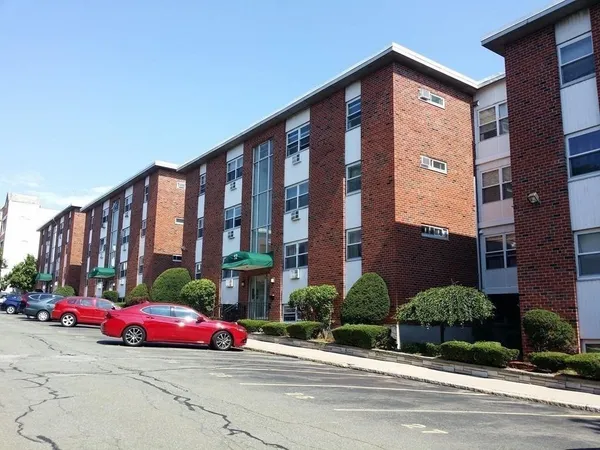 a kitchen with granite countertop a refrigerator and a sink