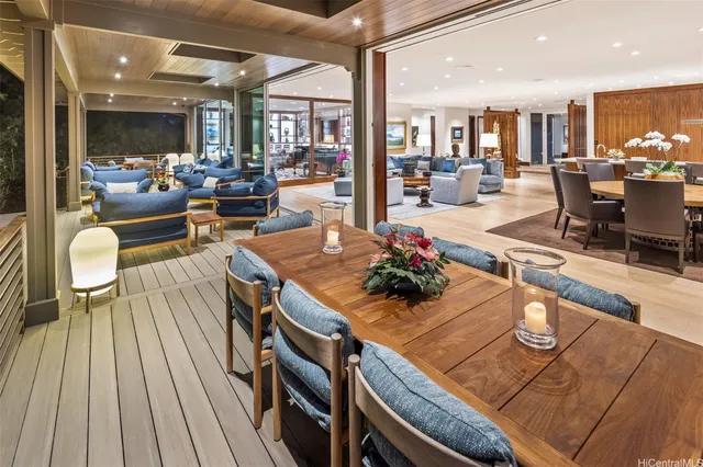 a view of a dining room with furniture a chandelier and wooden floor