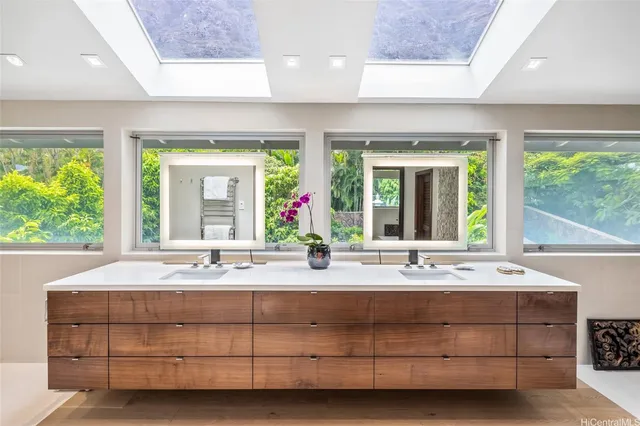 a bathroom with a sink and a large window
