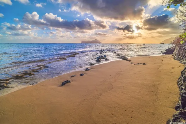 a living room with furniture windows and wooden floor