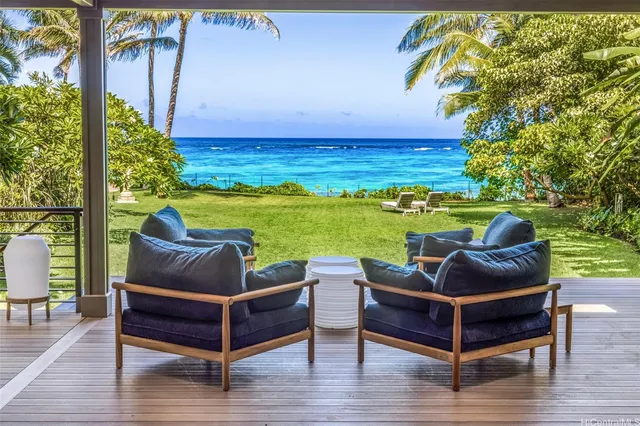 a view of a swimming pool and lounge chairs