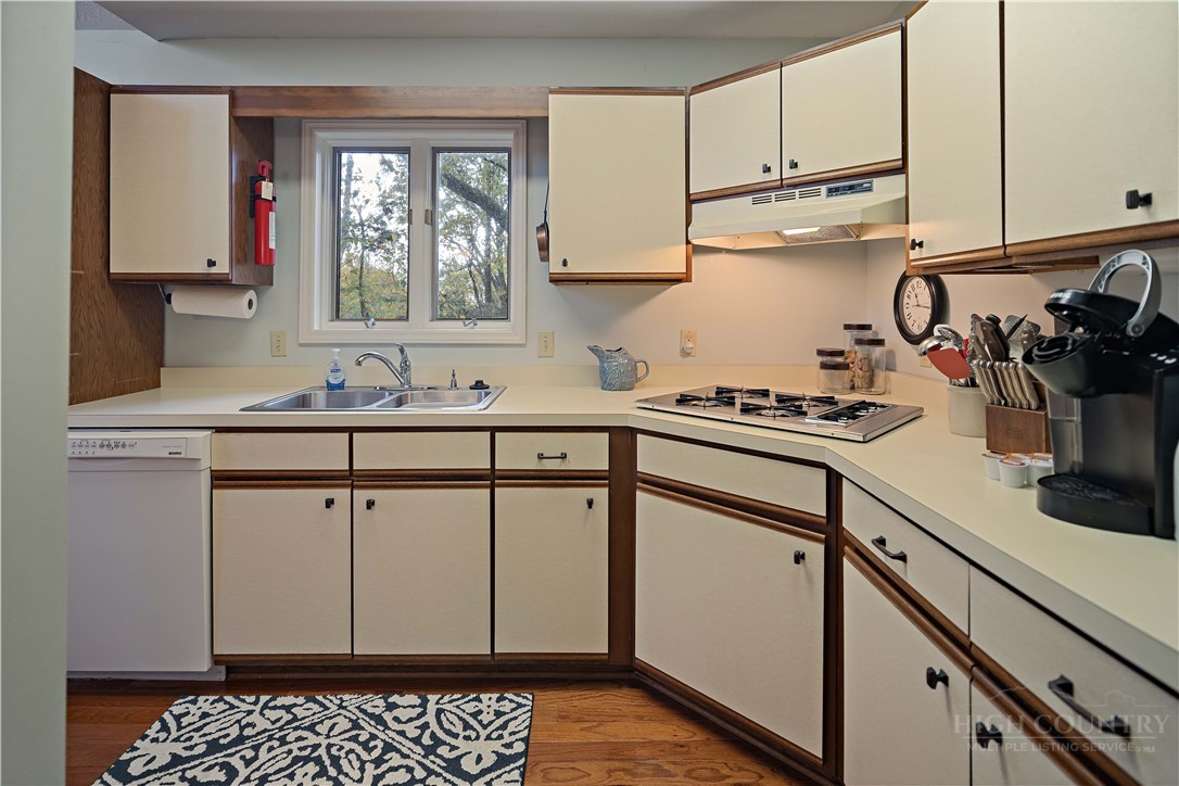 265 Leatherwood Road Banner Elk, NC 28604 - Photo 21 of 42 a kitchen with sink cabinets and window