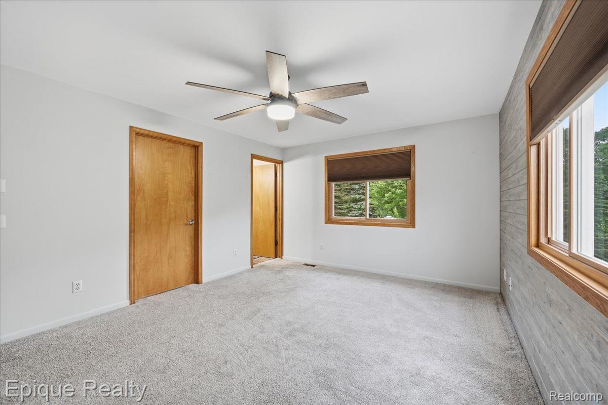 1221 Rhodes Road Lake Orion, MI 48360 - Photo 32 of 72 Interior room featuring light gray carpeting and white painted walls