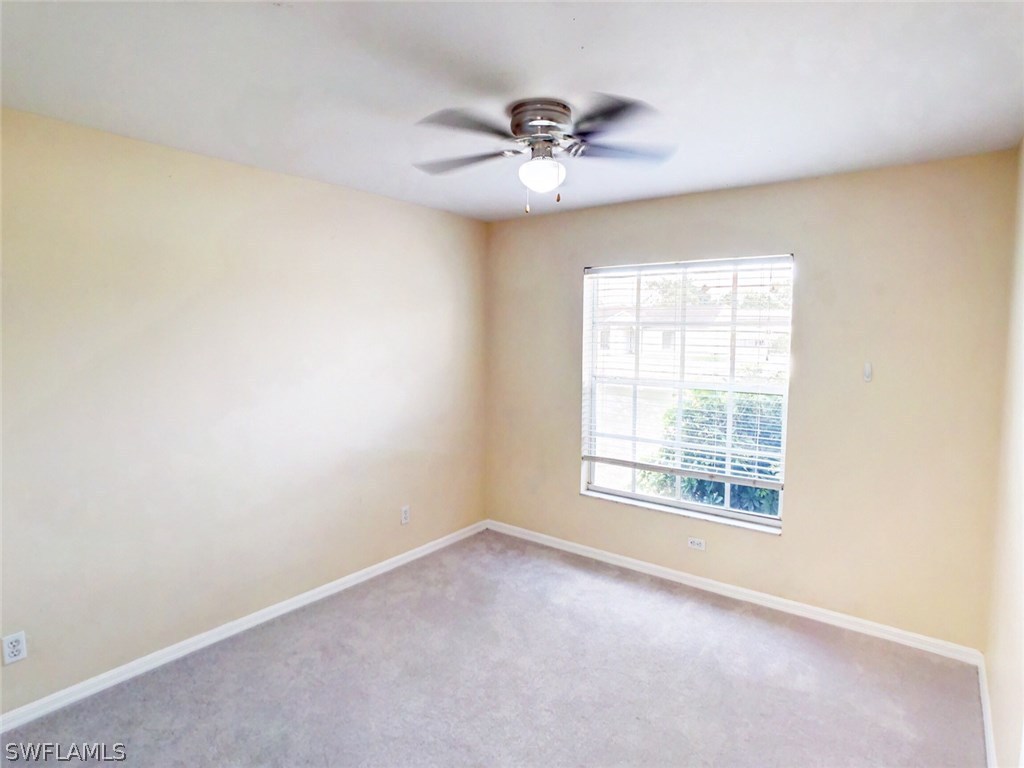 17424 Delaware Road Fort Myers, FL 33967 - Photo 11 of 12 a view of an empty room with a window
