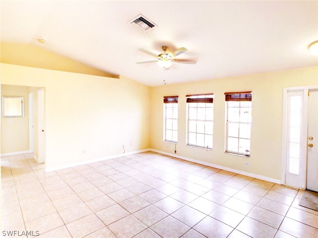 17424 Delaware Road Fort Myers, FL 33967 - Photo 3 of 12 a view of an empty room with a window