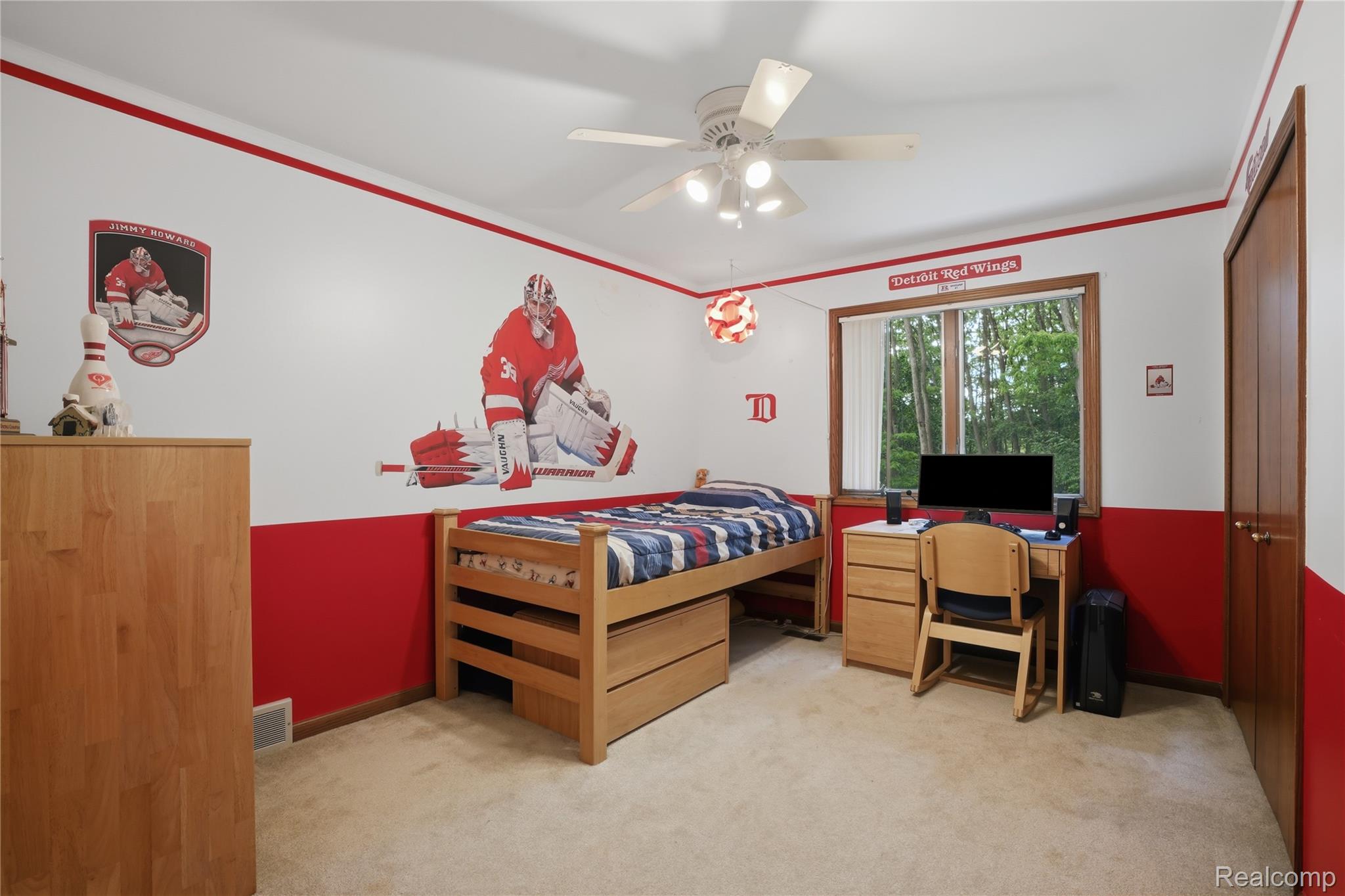 68345 Romeo Plank Road Ray, MI 48096 - Photo 39 of 52 Carpeted room featuring a ceiling fan with integrated lighting, a double-hung window, and a built-in closet with wood-finish doors