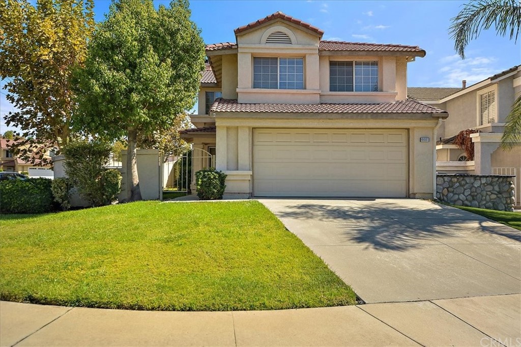 6681 Austin Court Rancho Cucamonga, CA 91701 - Photo 1 of 1 a front view of a house with a yard and garage