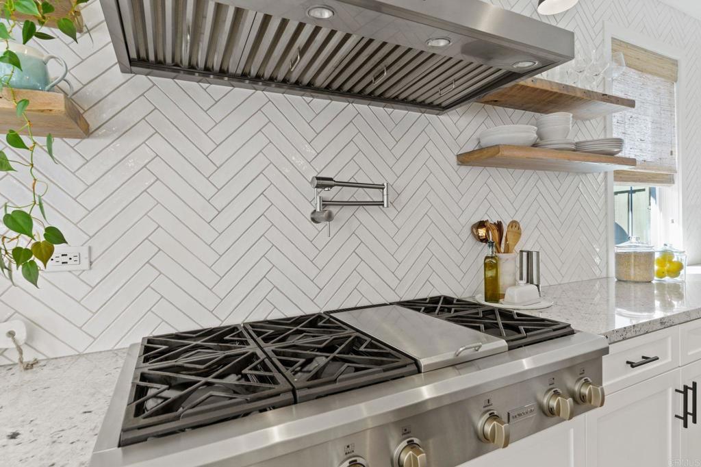 663 Polaris Drive Encinitas, CA 92024 - Photo 8 of 34 a close view of a stove top oven sitting on a bed