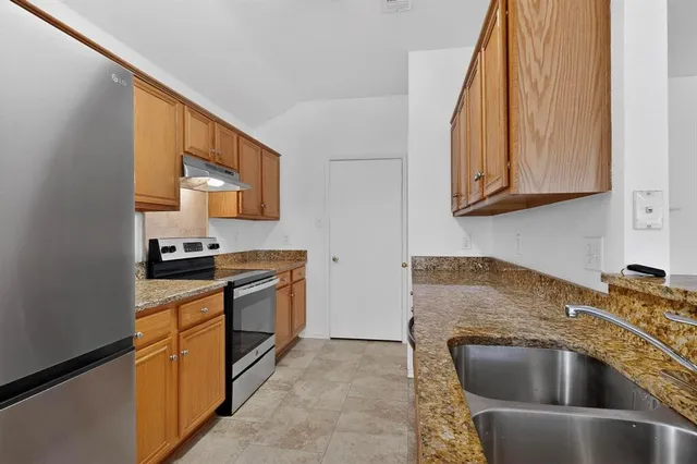 a view of kitchen with cabinets and wooden floor