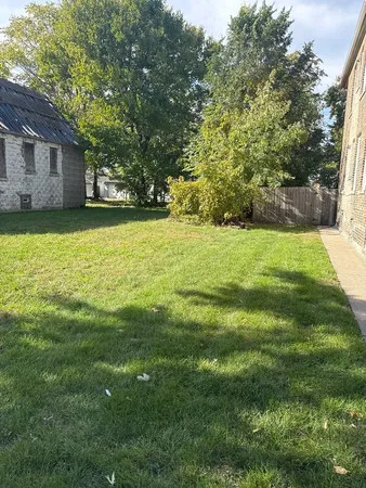 a backyard of a house with lots of green space
