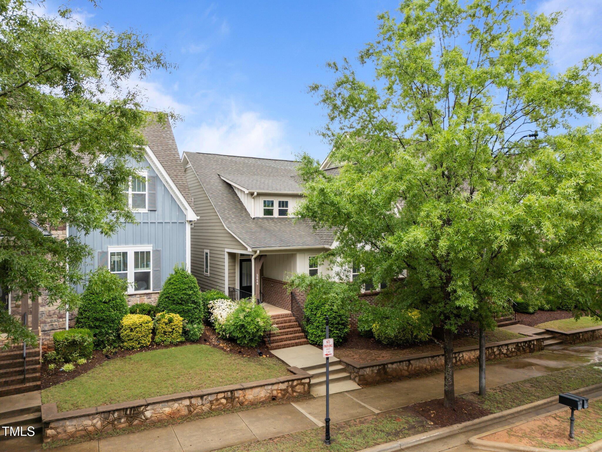 5644 Wade Park Boulevard Raleigh, NC 27607 - Photo 2 of 29 a front view of a house with a yard