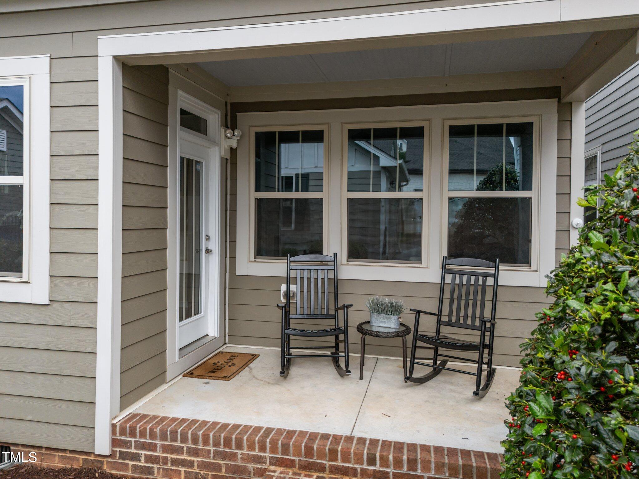 5644 Wade Park Boulevard Raleigh, NC 27607 - Photo 25 of 29 a balcony with table and chairs and potted plants