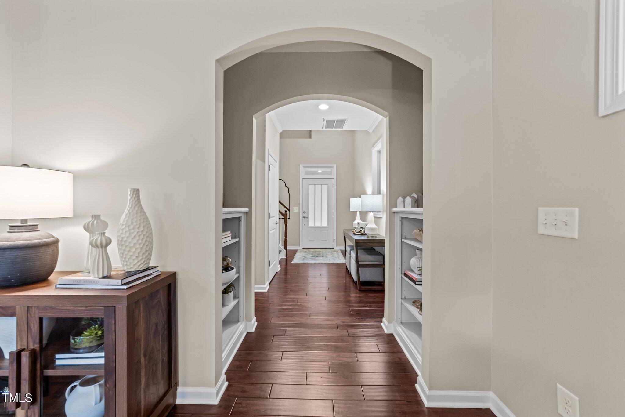 5644 Wade Park Boulevard Raleigh, NC 27607 - Photo 5 of 29 a view of a hallway with wooden floor and staircase