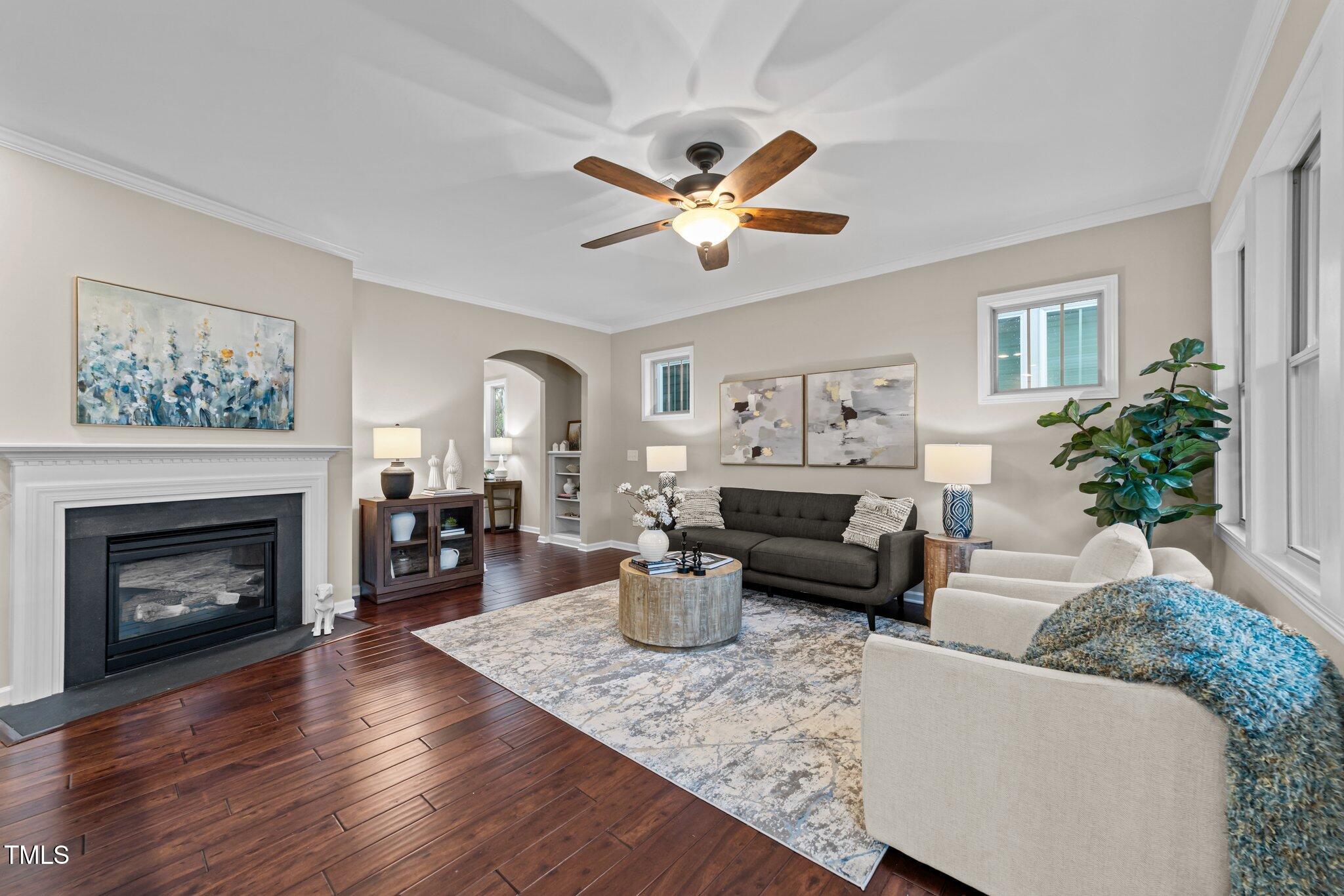 5644 Wade Park Boulevard Raleigh, NC 27607 - Photo 7 of 29 a living room with furniture and a fireplace