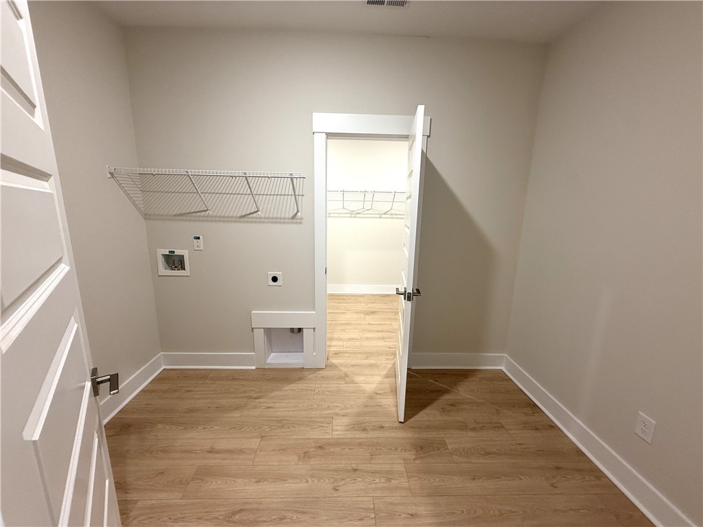 504 Tilman Court Anderson, SC 29621 - Photo 16 of 28 This dedicated laundry space combines practicality with bright, clean finishes for effortless home organization.