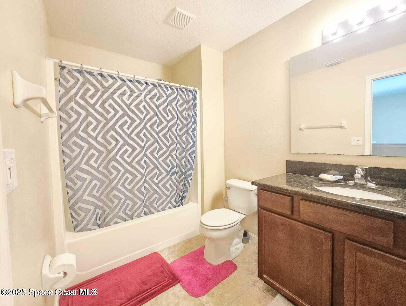 2735 Revolution Street, Unit 101 Melbourne, FL 32935 - Photo 18 of 24 a bathroom with a sink toilet and shower