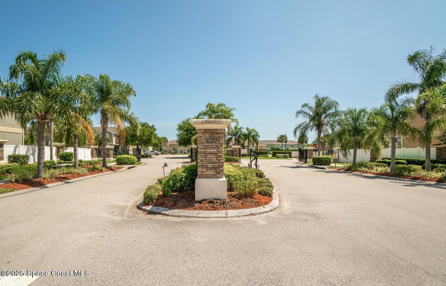 2735 Revolution Street, Unit 101 Melbourne, FL 32935 - Photo 19 of 24 a view of a park with a cars parked and small park