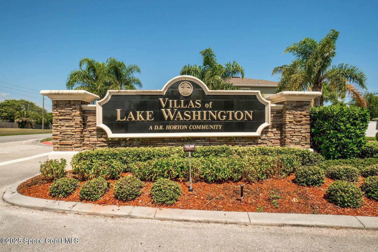 2735 Revolution Street, Unit 101 Melbourne, FL 32935 - Photo 20 of 24 a sign that is sitting on a brick wall