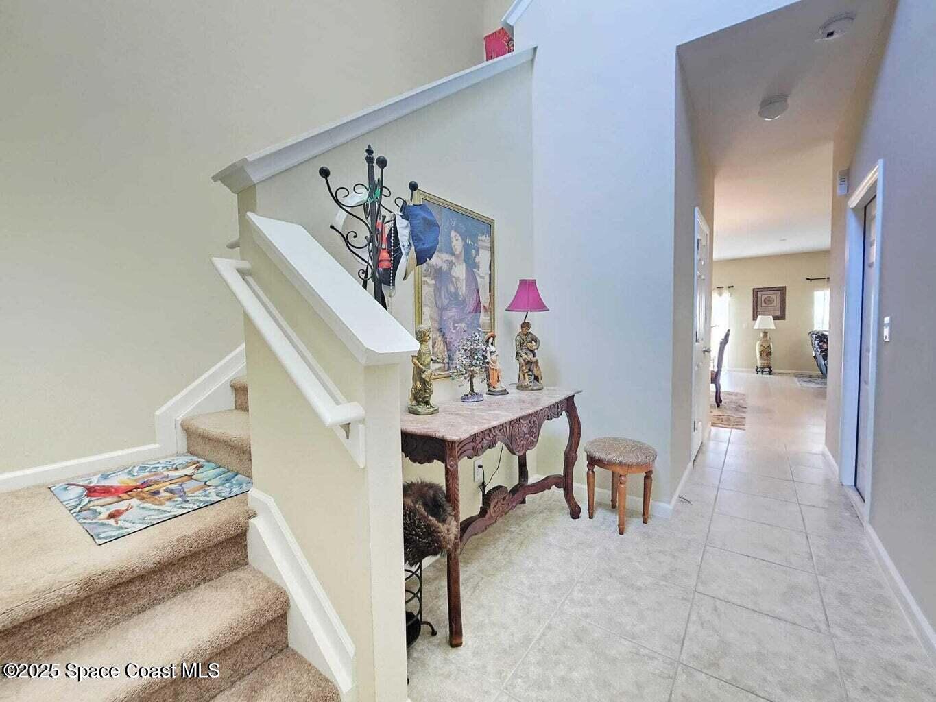 2735 Revolution Street, Unit 101 Melbourne, FL 32935 - Photo 7 of 24 a view of a livingroom with furniture and stairs