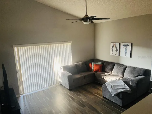 a living room with furniture and a window
