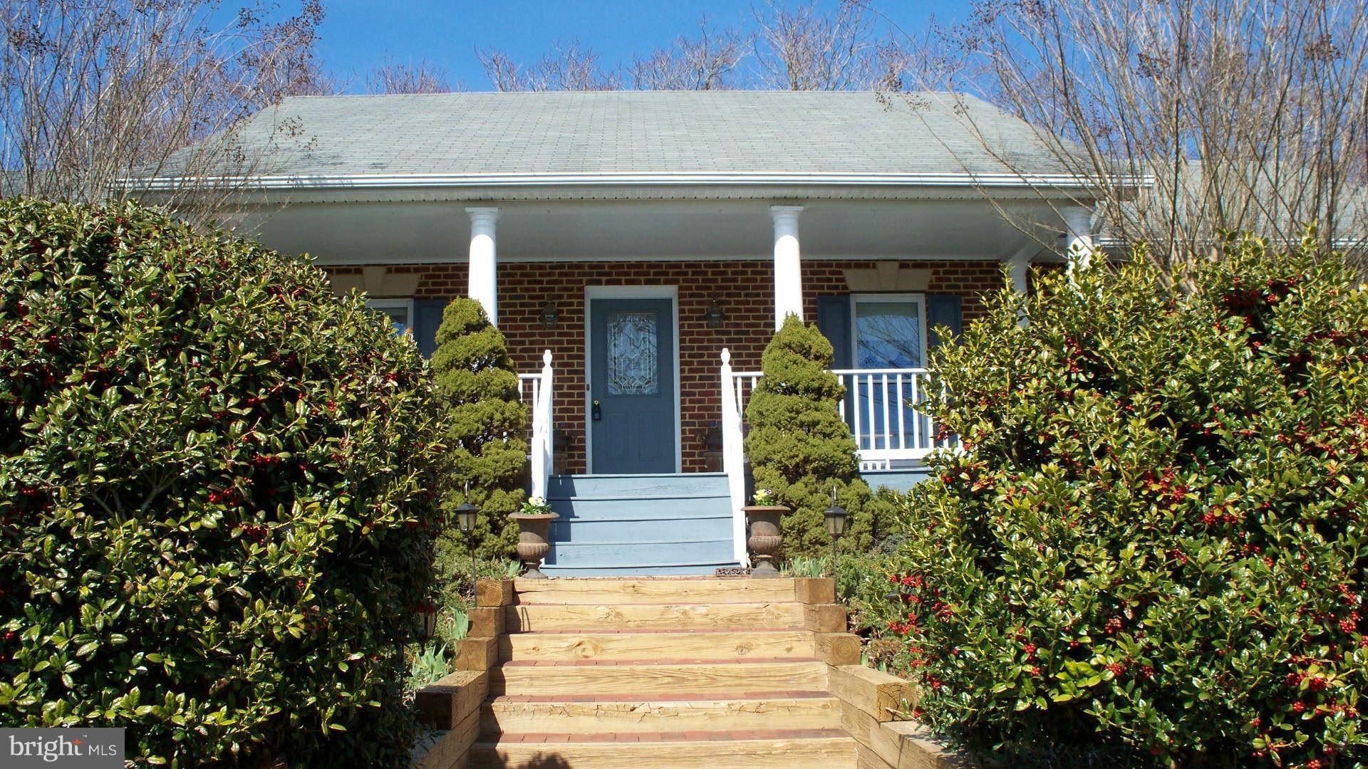 9519 Conde Road Marshall, VA 20115 - Photo 3 of 30 a front view of a house with plants