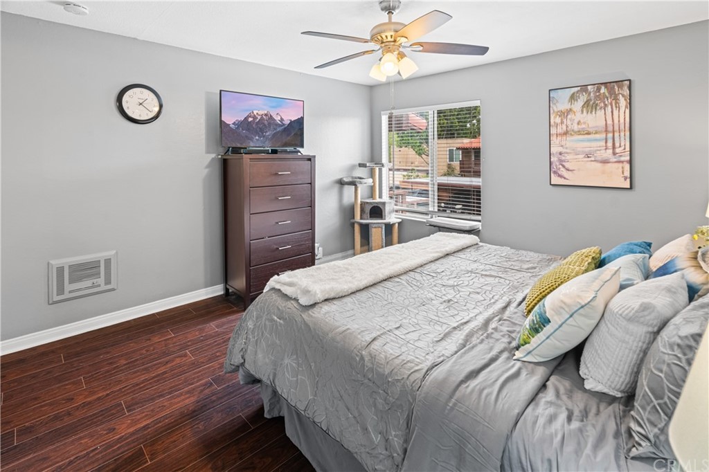 1040 West MacArthur Boulevard, Unit 104 Santa Ana, CA 92707 - Photo 19 of 30 a bedroom with a bed and a closet