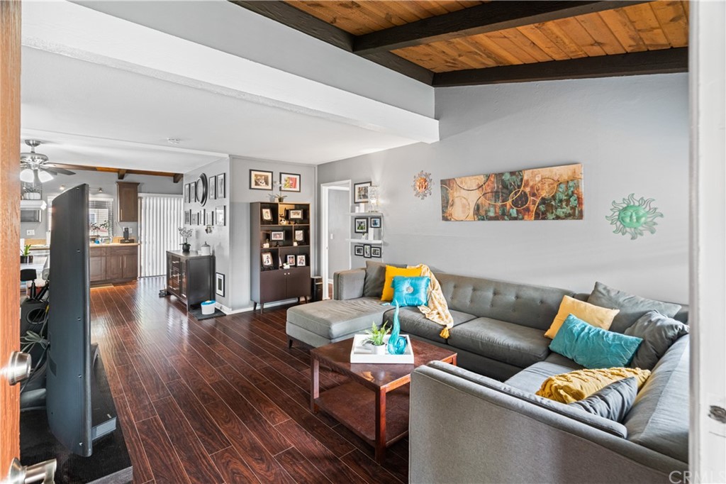 1040 West MacArthur Boulevard, Unit 104 Santa Ana, CA 92707 - Photo 2 of 30 a living room with furniture and wooden floor