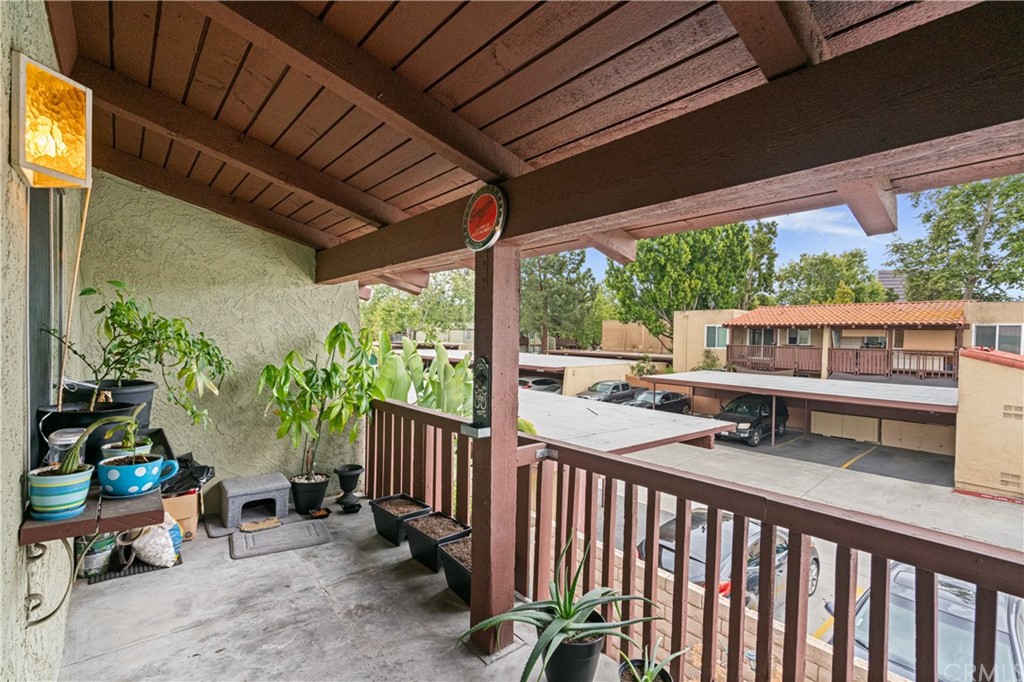 1040 West MacArthur Boulevard, Unit 104 Santa Ana, CA 92707 - Photo 24 of 30 a view of a porch with furniture and garden